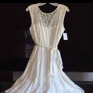 Sleeveless ivory lace dress.  Never worn.